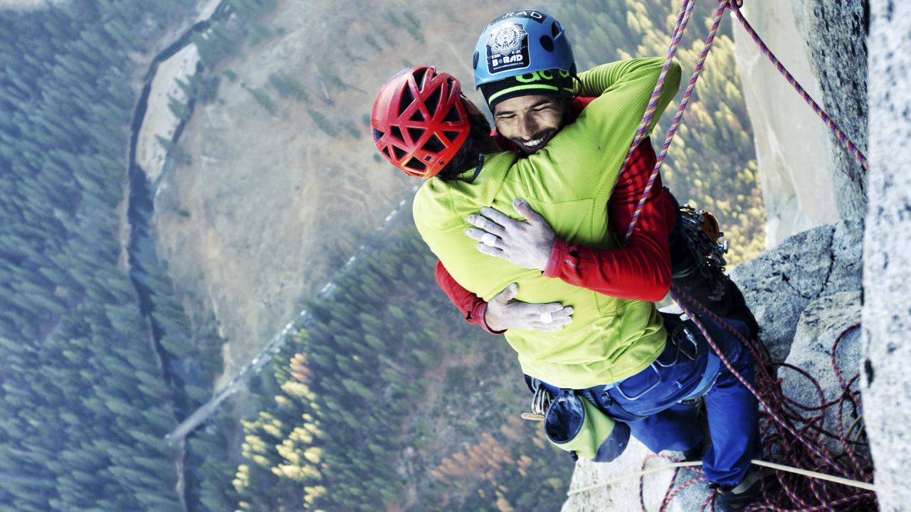 Free climbers Tommy Caldwell, left, and Kevin Jorgeson embrace Wednesday, January 14, after reaching the top of El Capitan, a 3,000-foot rock formation in California's Yosemite National Park. They are the first to successfully climb El Capitan's Dawn Wall using only their hands and feet.