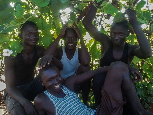 <br />"These four boys live alone on their compound with nobody to help them cook, clean, fetch water and firewood. They usually cooperate and get along to work together. They've planted pumpkins on their compound that are now ready for harvest."