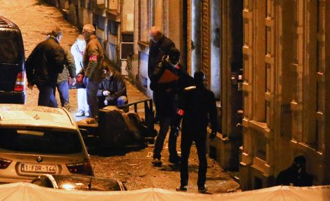 Police officers gather at the scene of an anti-terrorism operation in Verviers, Belgium, on Thursday, January 15. Two people were killed during a raid on a suspected terror cell, Belgian authorities said. A third suspect was injured and taken into custody.