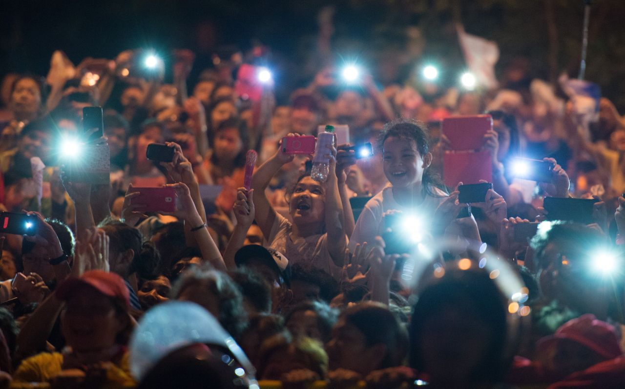 Well-wishers use their cell phones to try to capture the arrival of Pope Francis in Manila on January 15. In the Philippines, 80% of the population is Catholic. 