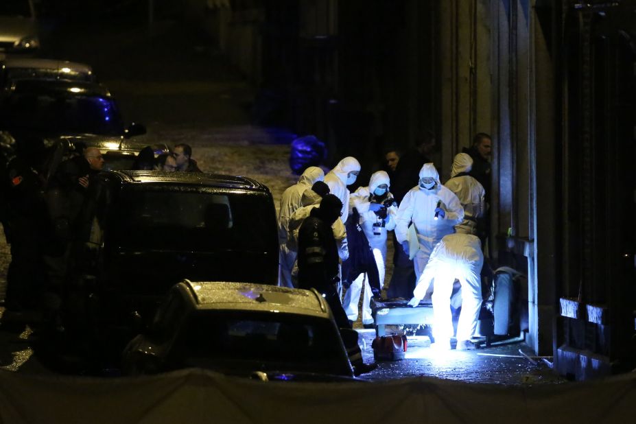 Police officers work in Verviers after the raid.