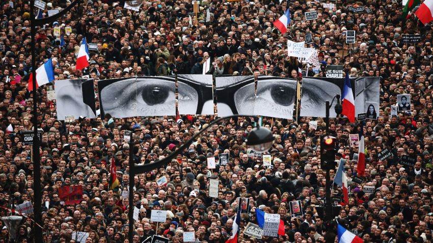 Demonstrators make their way along Boulevrd Voltaire in a unity rally in Paris following the recent terrorist attacks on January 11, 2015 in Paris, France. An estimated one million people are expected to converge in central Paris for the Unity March joining in solidarity with the 17 victims of this week's terrorist attacks in the country. French President Francois Hollande will lead the march and will be joined by world leaders in a sign of unity. The terrorist atrocities started on Wednesday with the attack on the French satirical magazine Charlie Hebdo, killing 12, and ended on Friday with sieges at a printing company in Dammartin en Goele and a Kosher supermarket in Paris with four hostages and three suspects being killed. A fourth suspect, Hayat Boumeddiene, 26, escaped and is wanted in connection with the murder of a policewoman.