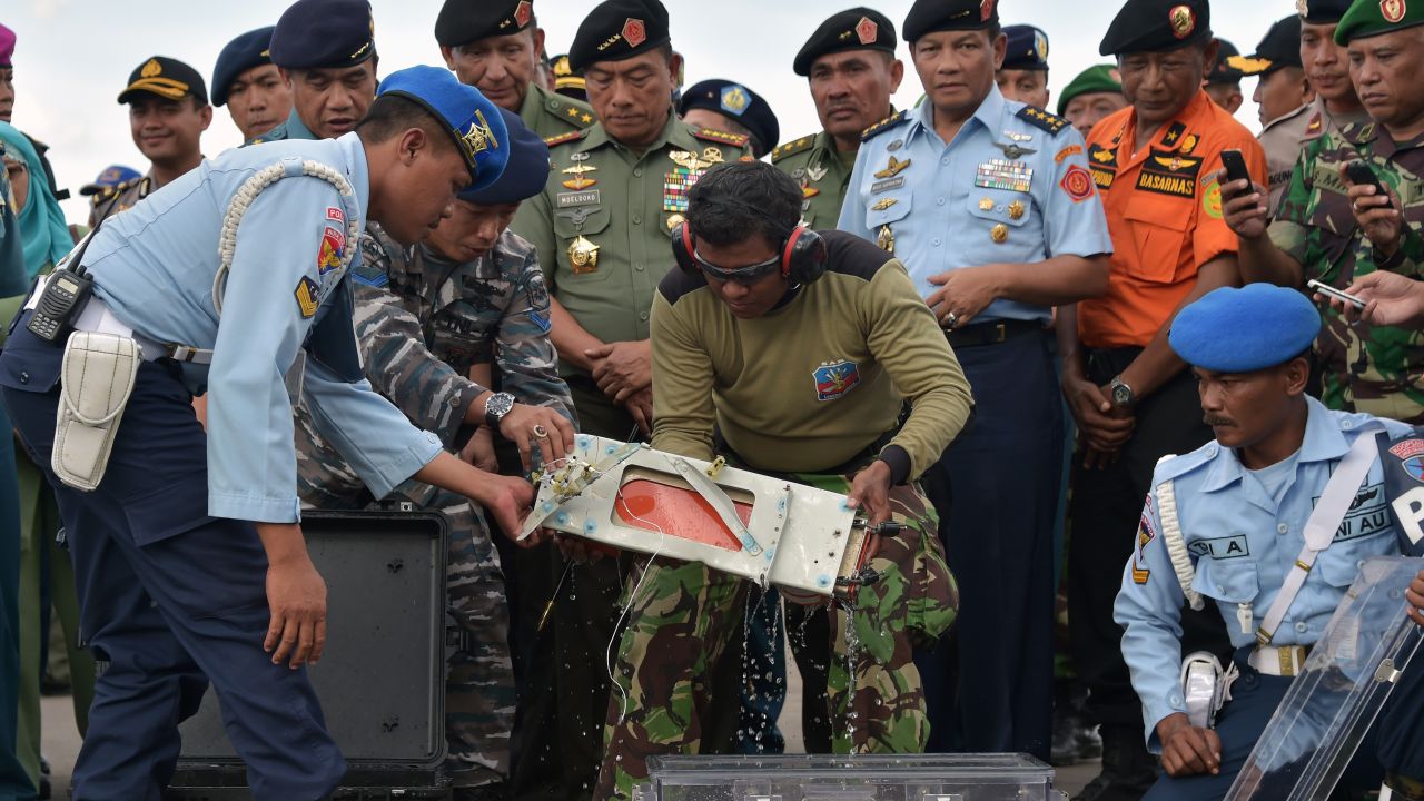 A flight data recorder from <a href="http://www.cnn.com/2014/12/28/asia/gallery/airasia-missing-plane/index.html" target="_blank">AirAsia Flight QZ8501</a> is retrieved from the Java Sea on Monday, January 12. The passenger plane was traveling from Surabaya, Indonesia, to Singapore when it lost contact with air traffic control on December 28. There were 162 people aboard.