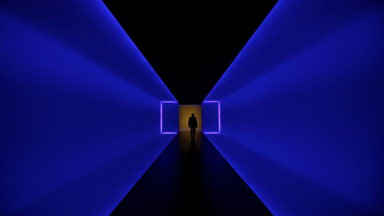 A man in Houston walks through a tunnel that connects two buildings at the Museum of Fine Arts on Tuesday, January 13. The tunnel, "The Light Inside," is the work of American artist James Turrell.