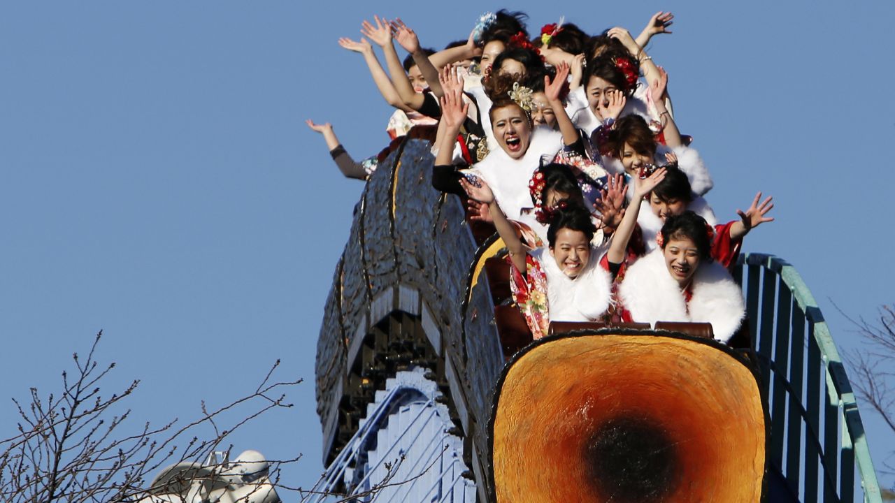Japanese women wearing kimonos ride a roller coaster at a Tokyo amusement park during a Coming of Age Day celebration on Monday, January 12.
