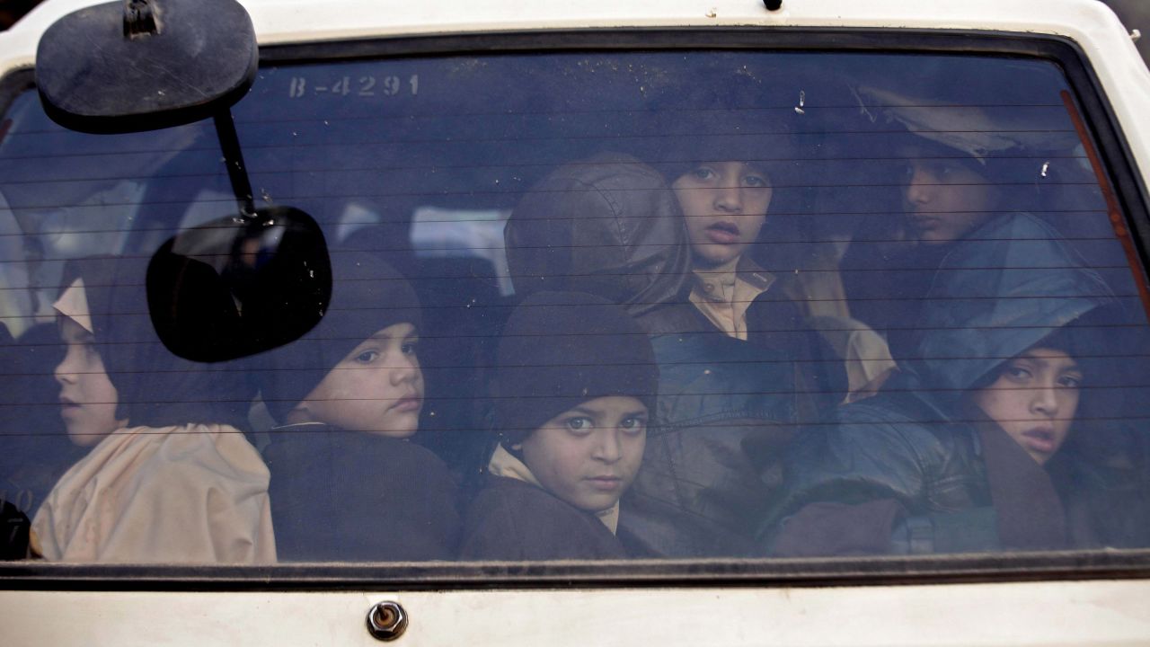 Children leave their school in Peshawar, Pakistan, after it was reopened on Monday, January 12. A month earlier, the school had closed after <a href="http://www.cnn.com/2014/12/16/asia/gallery/taliban-attack-peshawar-school/index.html" target="_blank">Taliban gunmen killed at least 145 people there. </a>