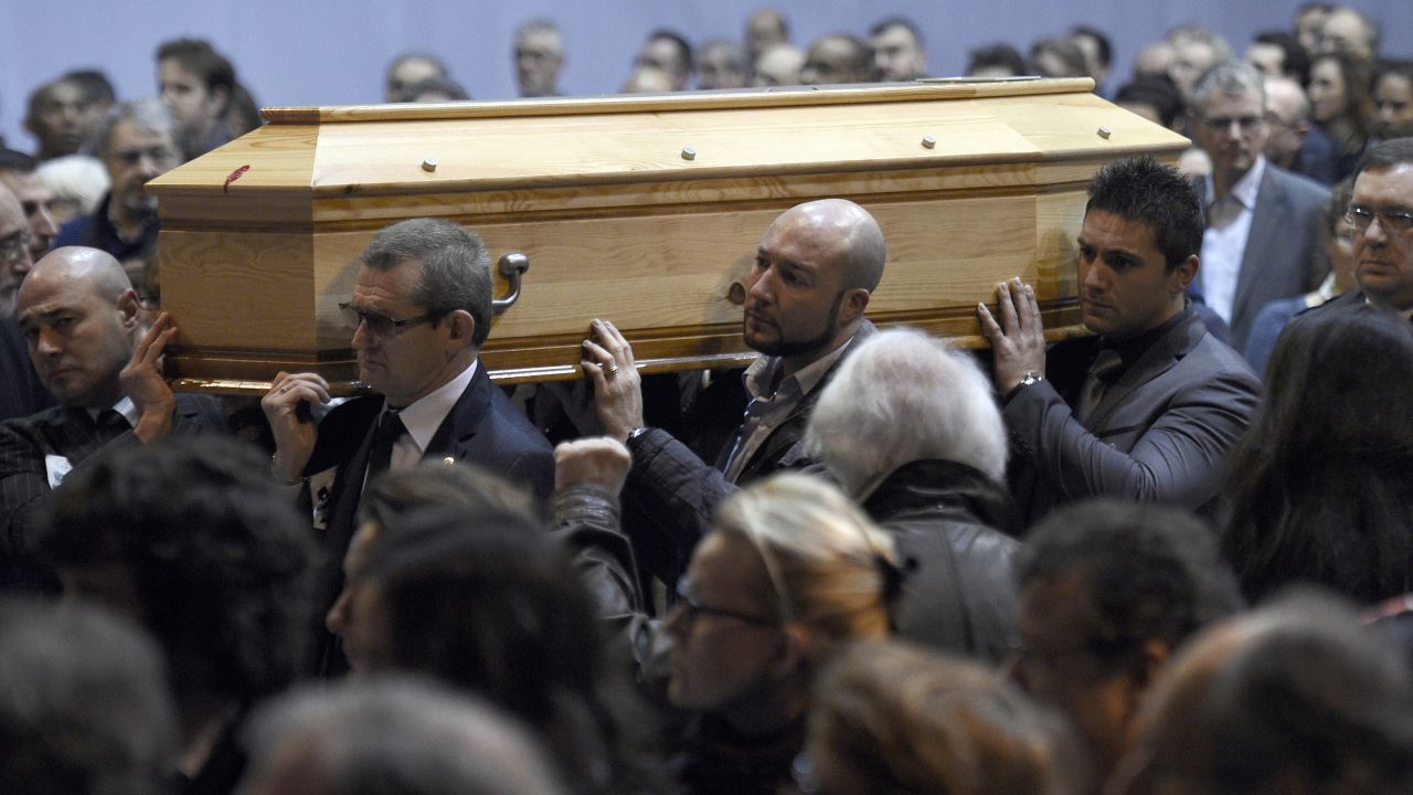 Charlie Hebdo editor Stephane "Charb" Charbonnier is put to rest in Pontoise, France, on January 16.