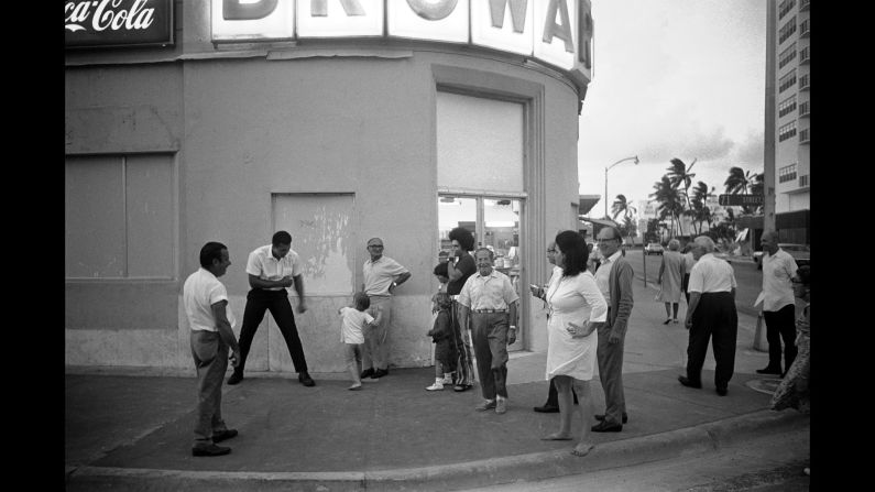 Ali horses around with a child on a street corner in Miami Beach, Florida. He was in town to train for his second fight against Jerry Quarry. 