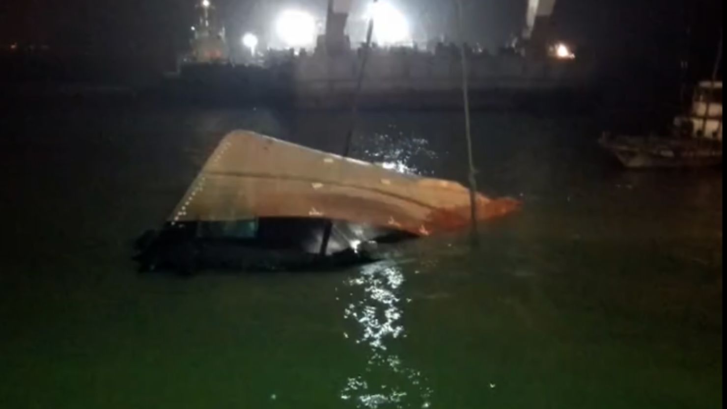 Rescuers attempt to salvage a tug which sank on China's Yangtze River. 
