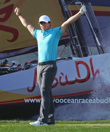 Rory McIlroy celebrates his first hole-in-one in a professional event on the way to a 66 for 11-under-par at halfway in the Abu Dhabi Championship. 'I knew as soon as it left the club it had a chance," he said after his perfect nine-iron shot to the 177-yard 15th.