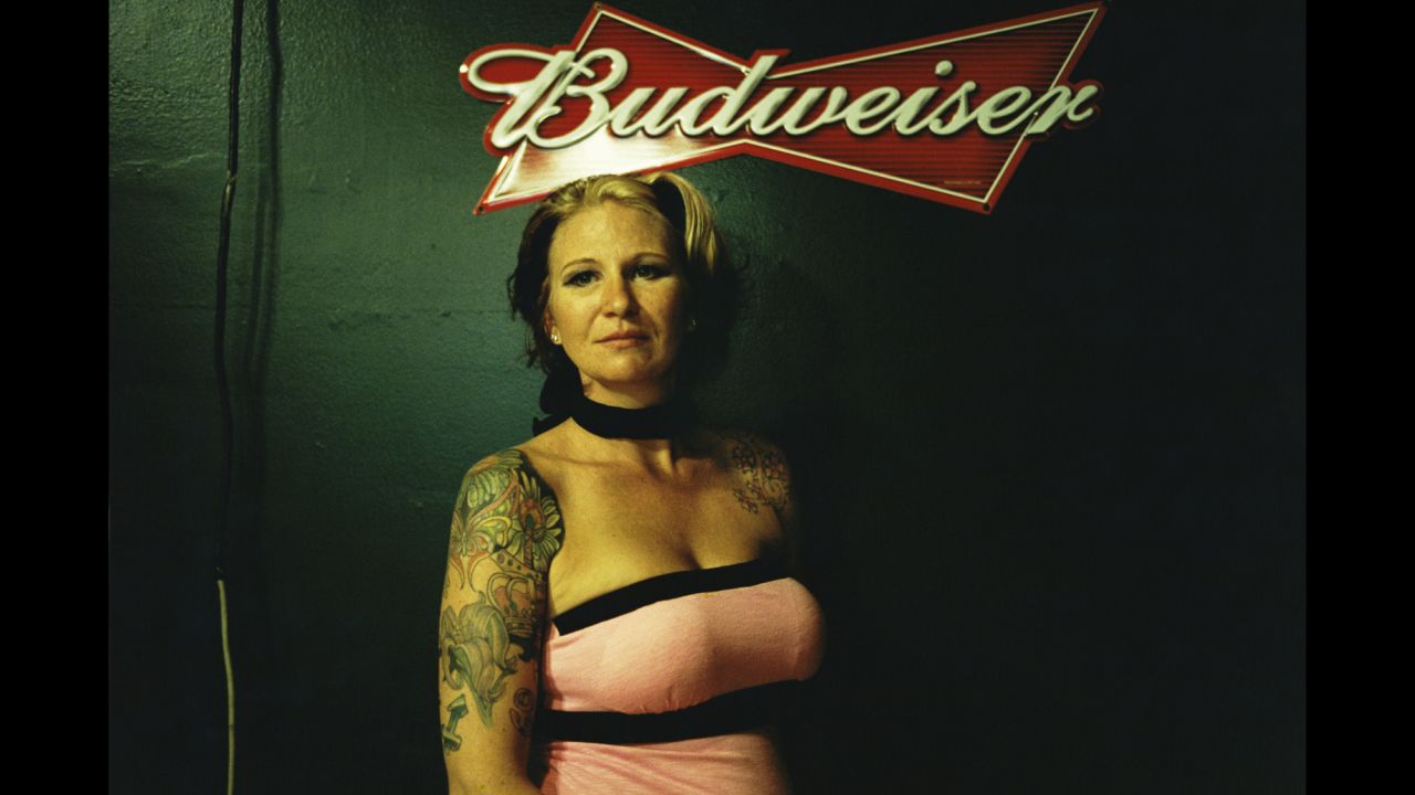 A woman stands in a bar in Deadwood, South Dakota.