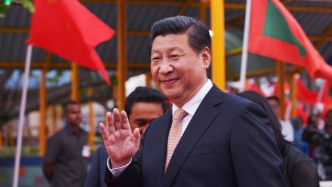 Chinese President Xi Jinping gestures as he arrives near the capital Male in the Maldives on September 14, 2014. Chinese President Xi Jinping arrived in the Maldives making a historic visit to the Indian Ocean tourist destination at the start of a three-nation South Asian tour. Maldivian President Abdulla Yameen received Xi and his entourage at the international airport, located on a small islet near the capital island Male where an official state welcome awaits him September 15. AFP PHOTO/STR (Photo credit should read STR/AFP/Getty Images)