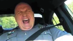 pkg orig cop sings Taylor Swift in squad car