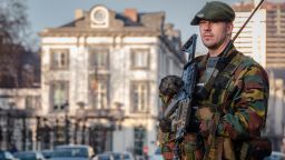 A Belgian para-commando patrols near the office of the prime minister in Brussels, on Saturday, Jan. 17, 2015. Security around Belgium has been stepped up after thirteen people were detained in Belgium in an anti-terror sweep following a firefight in Verviers, Belgium, in which two suspected terrorists were killed. (AP Photo/Geert Vanden Wijngaert)