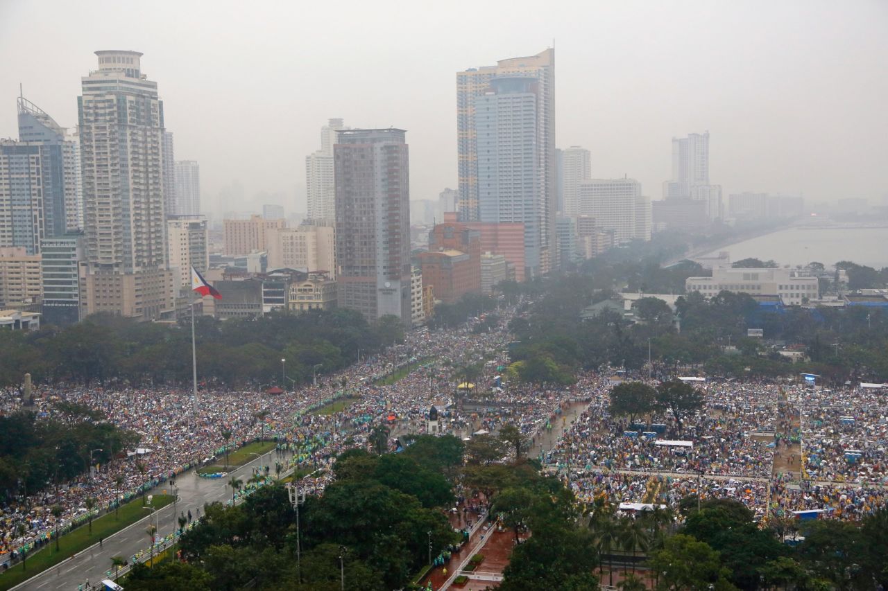 Millions brave the falling rain as they fill Rizal Park and the surrounding area in Manilla on January 18 to hear Pope Francis celebrate mass.