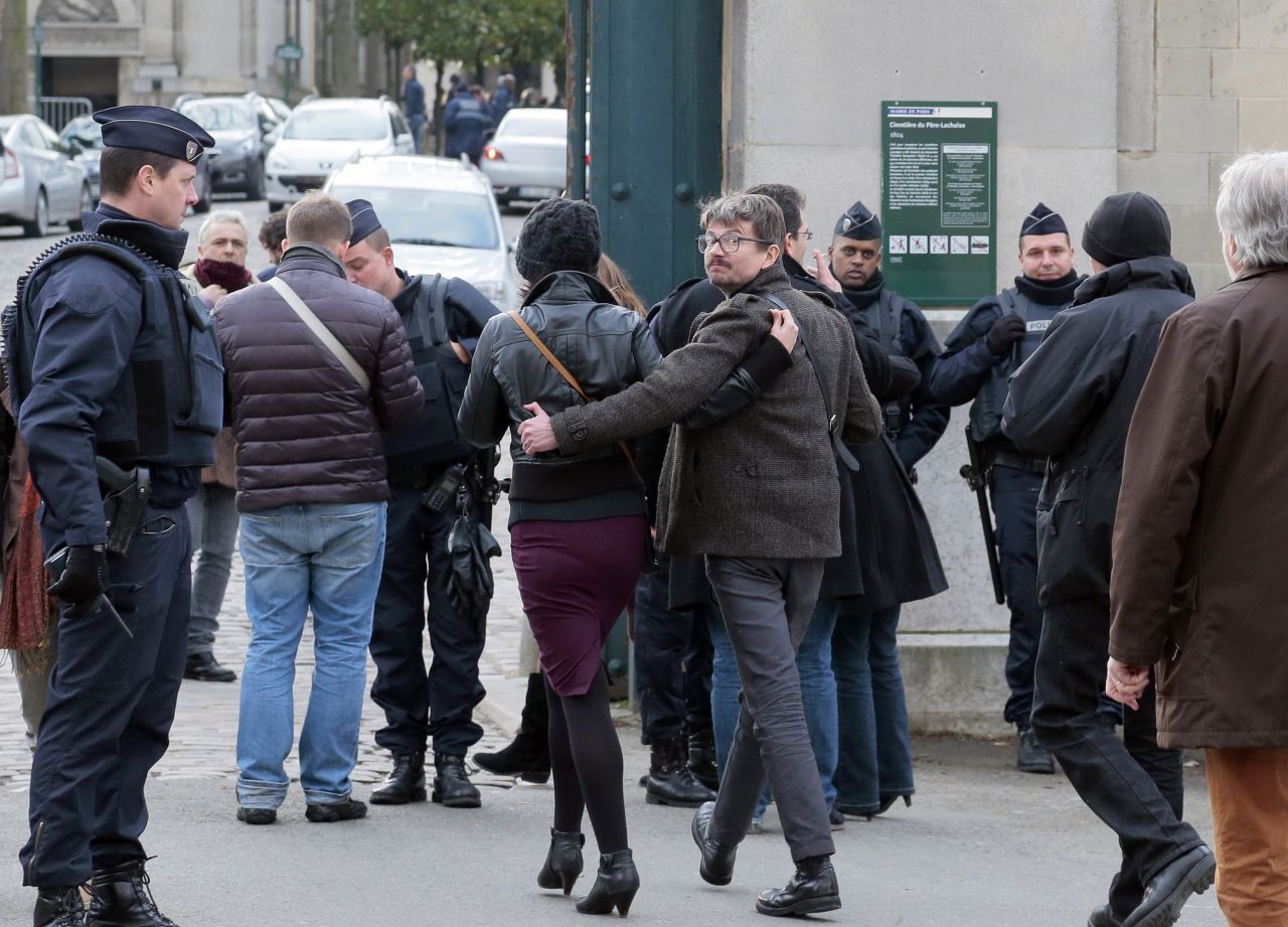 French cartoonist Renald Luzier, aka Luz, arrives at the Paris cemetery for Ourrad's funeral.