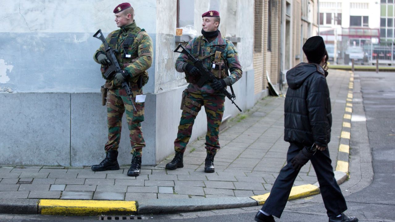 Belgian para-commandos patrol near a synagogue in the center of Antwerp, Belgium, on Saturday, Jan. 17, 2015. Security around Belgium has been stepped up after thirteen people were detained in Belgium in an anti-terror sweep following a firefight in Verviers, Belgium, in which two suspected terrorists were killed. (AP Photo/Virginia Mayo)