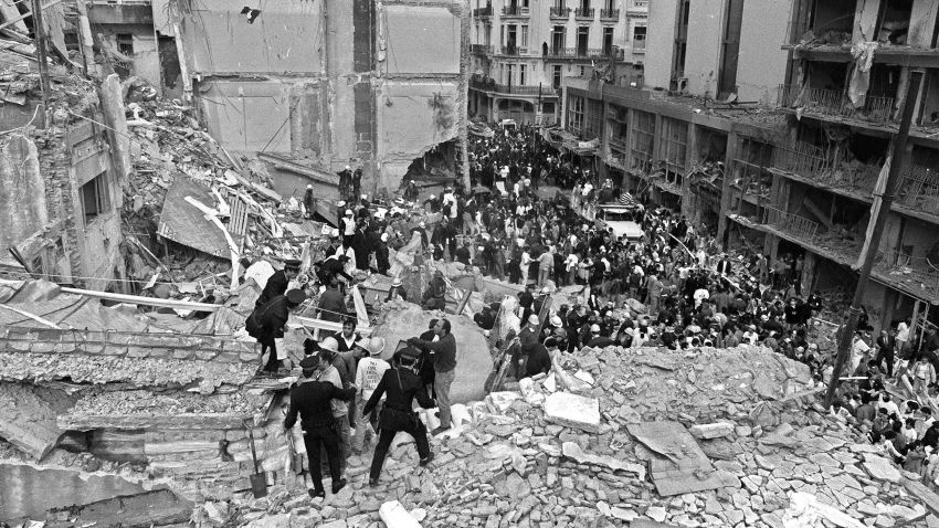 (FILE) Firemen and policemen search for wounded people after a bomb exploded at the Argentinian Israelite Mutual Association (AMIA) in Buenos Aires, 18 July 1994.The Jewish community in Argentina expressed vehement opposition on January 28, 2013 to Argentina and Iran's agreement to create a "truth commission" to probe a 1994 bombing of a Jewish center that killed 85 people. On Sunday, President Cristina Kirchner announced a deal with Tehran for a probe by a commission composed of five independent judges -- none of whom would be from either Iran or Argentina.   AFP PHOTO/Ali BURAFI        (Photo credit should read ALI BURAFI/AFP/Getty Images)