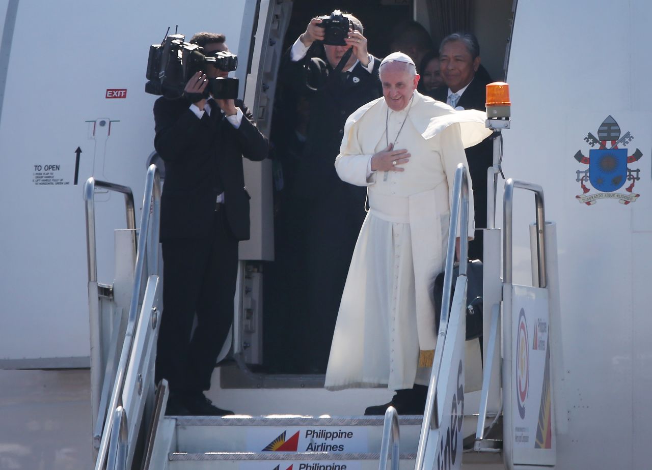 Pope Francis bids goodbye as he leaves Villamor Airbase for Rome on January 19 in Manila. Pope Francis has ended his five- day visit to the Philippines. The visit attracted millions as Filipino Catholics flocked to catch a glimpse of the leader of the Catholic Church. It was the first visit by a pope to the country since 1995.