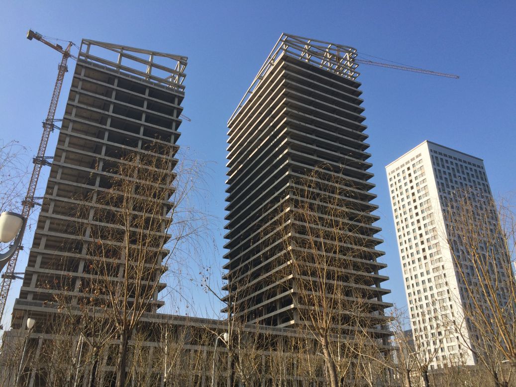China's boom has been fueled by real estate and "ghost cities" like Yujiapu are often the result of wasteful construction -- too many buildings -- and not enough tenants.