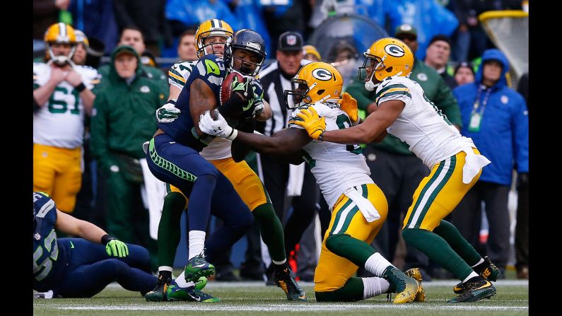 Chris Matthews recovers an onside kick for the Seattle Seahawks during the fourth quarter of the NFC Championship, which was held Sunday, January 18, in Seattle. The Seahawks, the defending world champions, fell behind 16-0 but staged an improbable comeback to defeat the Green Bay Packers 28-22 in overtime. They will face the New England Patriots in the Super Bowl.