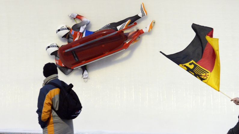 Canadians Justin Snith, left, and Tristan Walker crash Saturday, January 17, during the Luge World Cup in Oberhof, Germany.