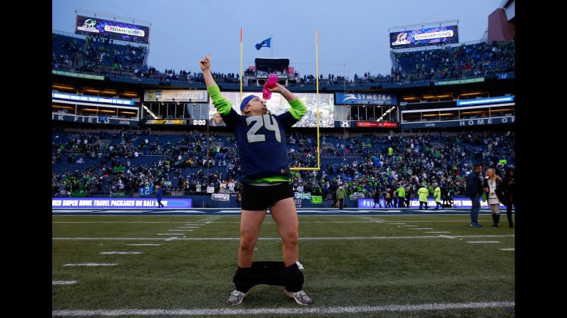 A Seattle Seahawks fan celebrates at CenturyLink Field after the home team won the NFC Championship on Sunday, January 18.
