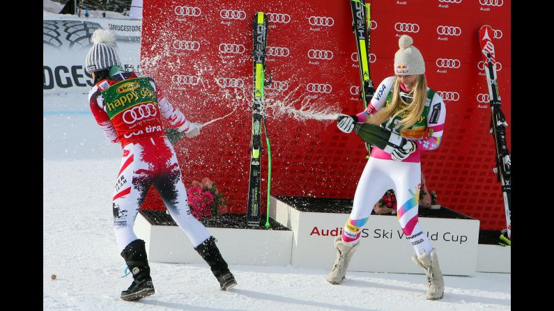 American skier Lindsey Vonn, right, and Austrian skier Anna Fenninger spray champagne on each other Monday, January 19, after finishing first and second in a World Cup race in Cortina d'Ampezzo, Italy. Vonn's win in the super-G was her record 63rd World Cup victory. 