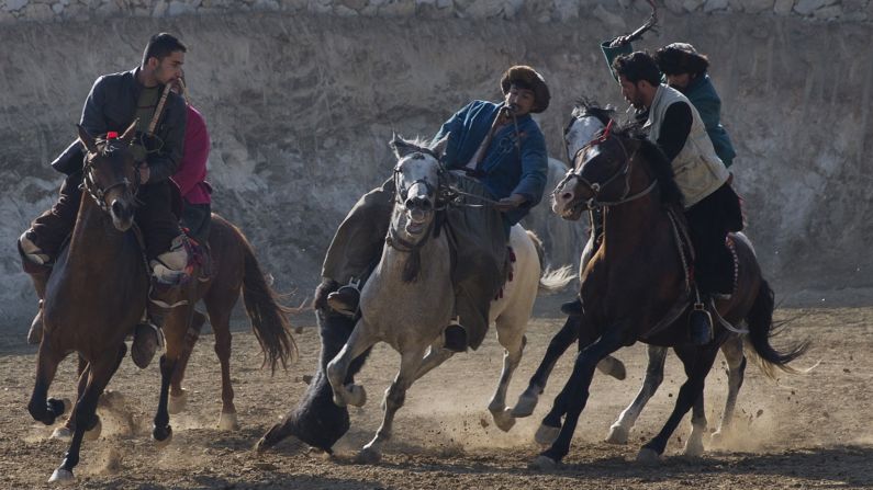 Horse riders compete for the goat during a buzkashi match on the outskirts of Kabul, Afghanistan, on Thursday, January 15. In buzkashi, the national sport of Afghanistan, players compete to place a goat carcass into a goal circle.