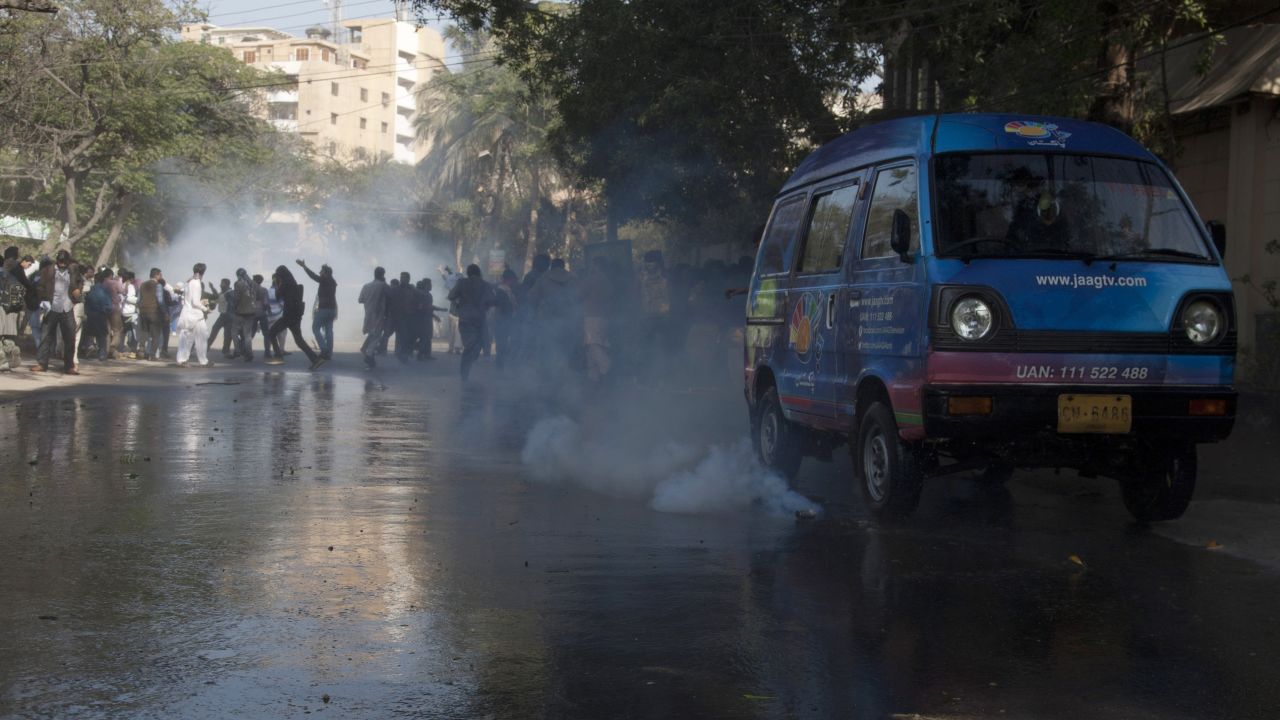 Police fire tear gas to disperse protesters in Karachi on January 16.