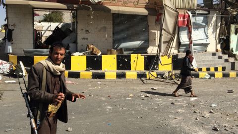 An armed member of the Houthi movement stands guard in the streets of Sanaa on January 20.