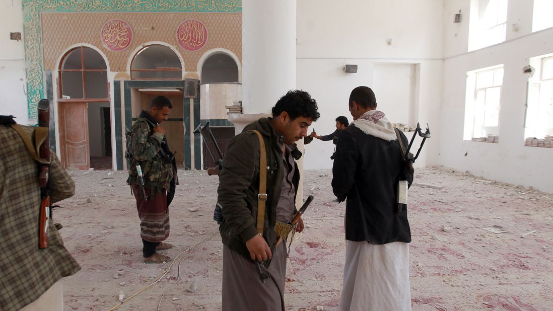 Houthis inspect a damaged mosque in Sanaa on January 20.