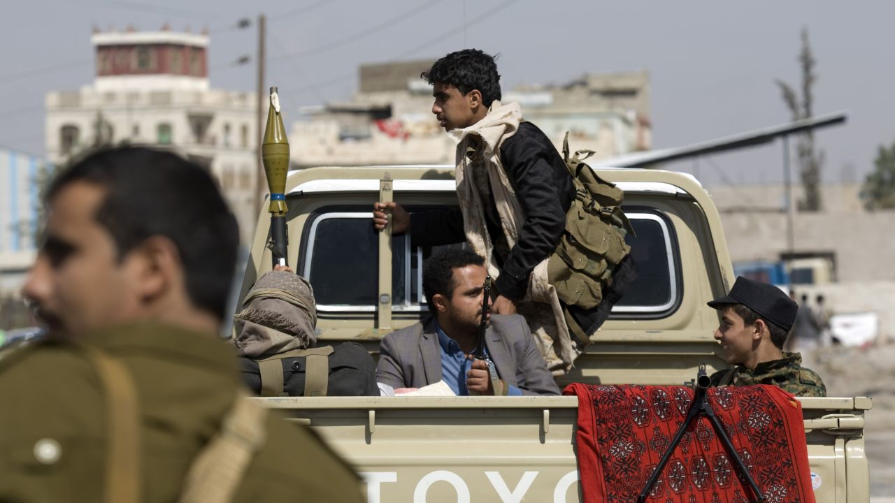 Houthi men guard a Sanaa street on January 19.