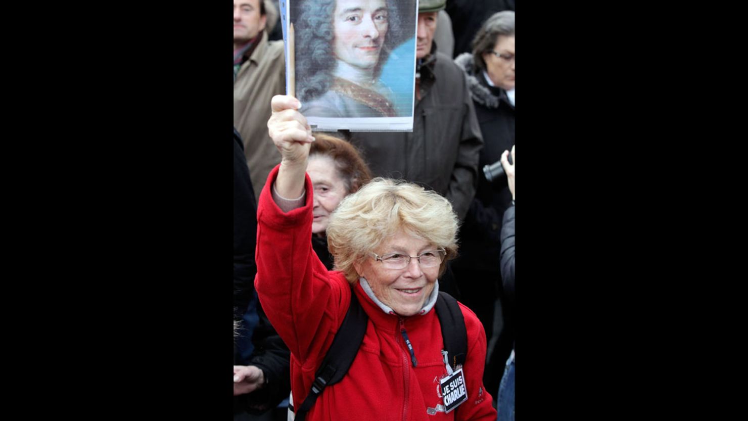 A demonstrator last week on the boulevard named for Voltaire carries a poster of the author.
