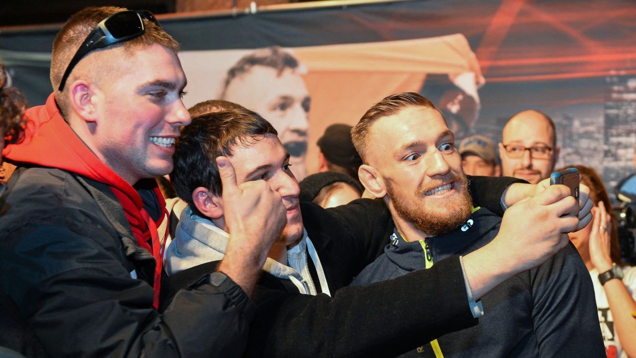 UFC competitor Conor McGregor, right, squeezes in with fans in Boston on Friday, January 16. McGregor won the main event at UFC Fight Night two days later. 