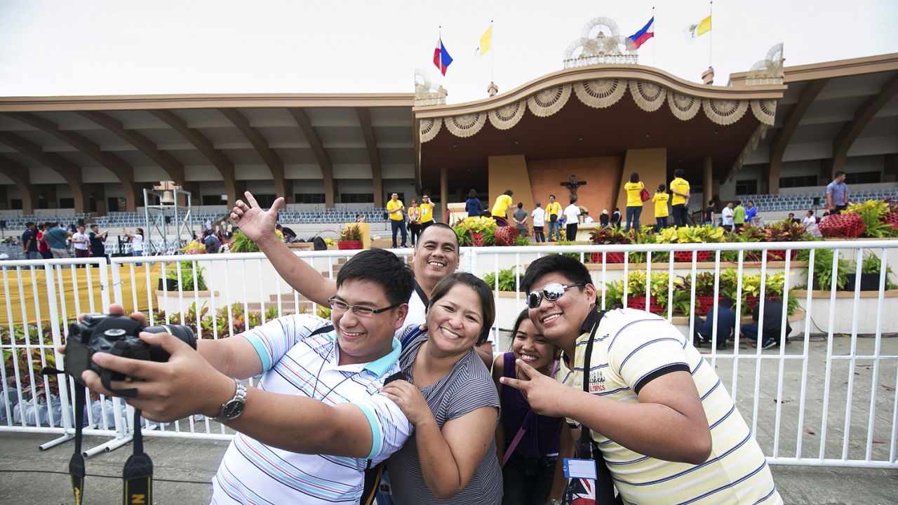 A family takes a selfie in Manila, Philippines, on Saturday, January 17, ahead of a Mass that would be officiated by Pope Francis. 