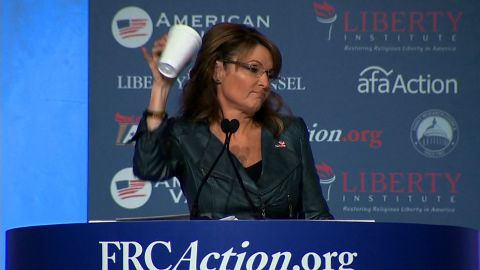 Palin takes a jab at President Barack Obama in September, mocking his "coffee cup salute" moment. Obama drew criticism after the White House posted a video to Instagram featuring him walking off Marine One offering a less-than-formal salute with a coffee cup in hand.
