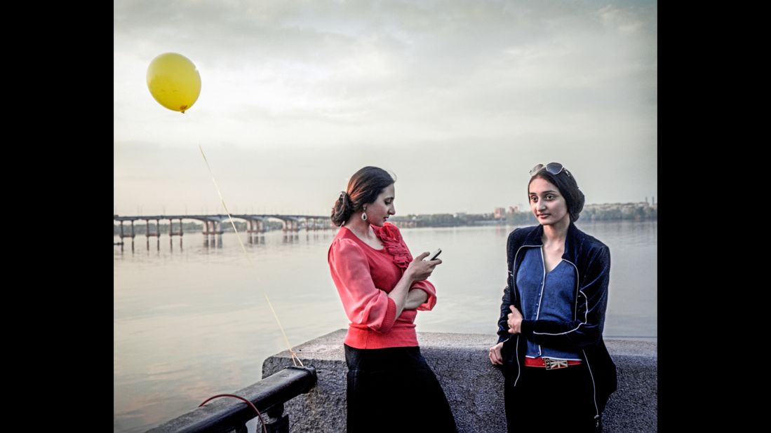 Sisters stroll along the Dnieper River. <br />
