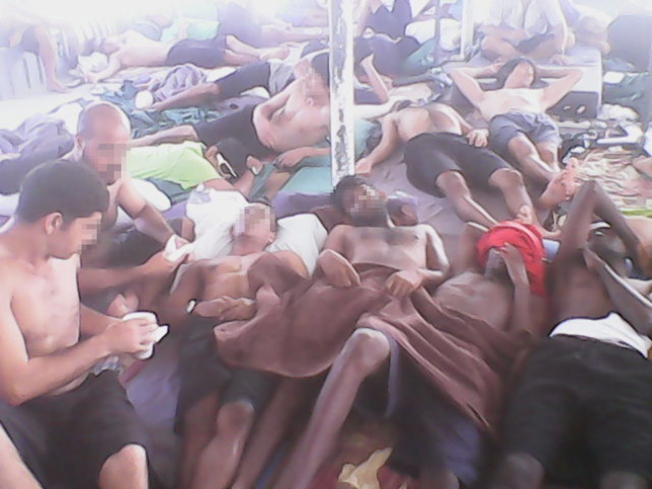 Asylum seekers at the Manus Island detention center lie in the heat after several days of hunger striking. Advocates say as many as 700 are refusing food in protest against plans to send some confirmed refugees to another, less secure facility on the island. This image was said to have been taken on Monday, January 19.