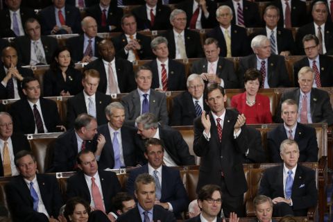 Rep. Martin Heinrich, D-New Mexico, applauds Obama while surrounded by Republican members of Congress.