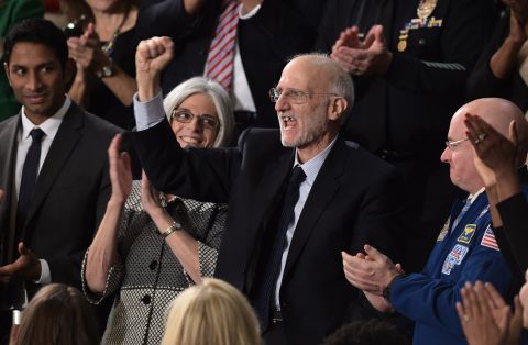 Alan Gross, center, a U.S. contractor released from prison in Cuba last month, is applauded during the speech.