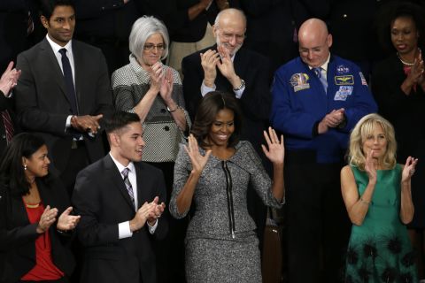 First lady Michelle Obama, center, arrives for the State of the Union address. At right is Dr. Jill Biden, wife of Vice President Joe Biden.