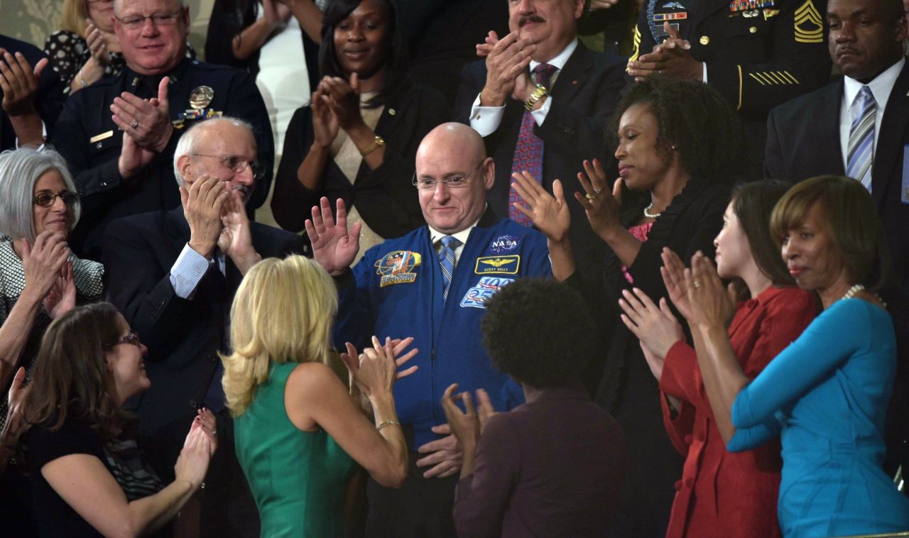 NASA astronaut Scott Kelly, center, is recognized by Obama during the speech. Kelly is preparing to spend a year on the International Space Station.