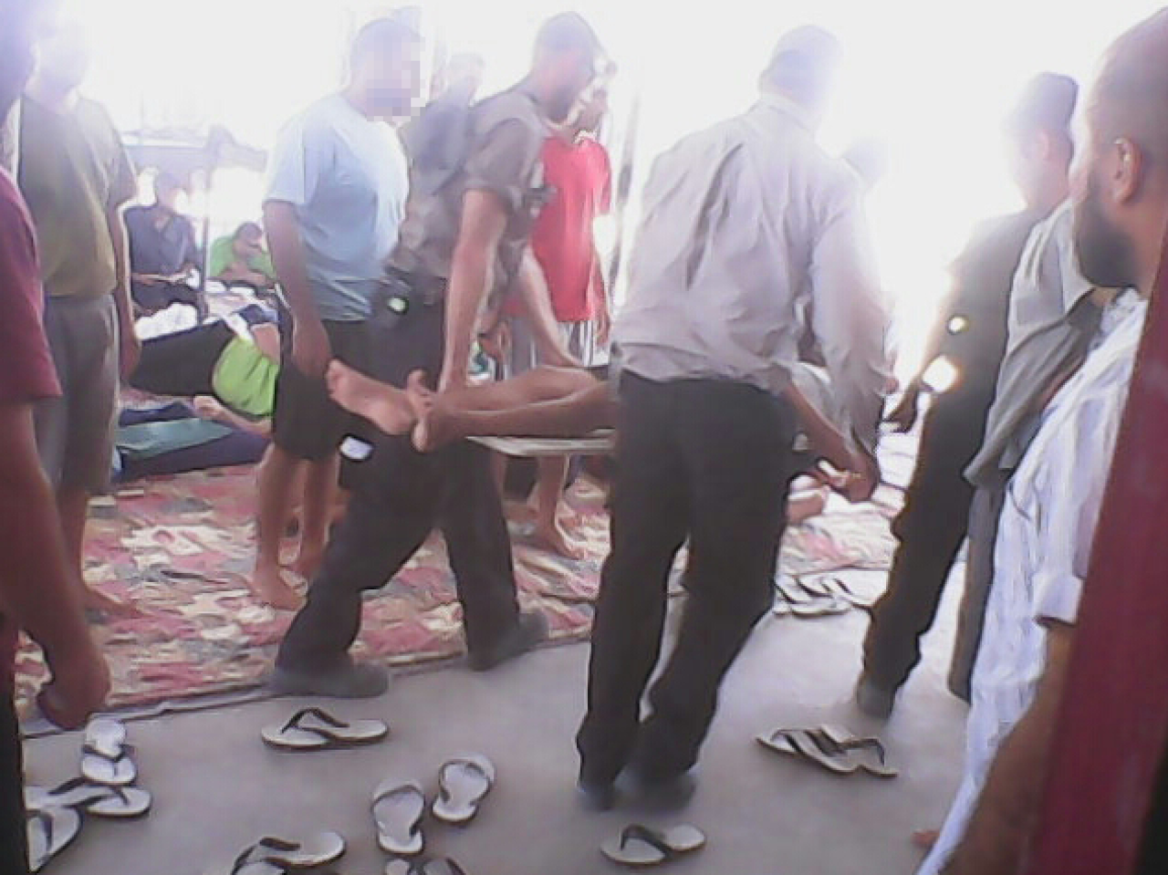 A hunger striker is carried away on a stretcher from one of the compounds at Manus Island detention center in a photo taken on January 19.
