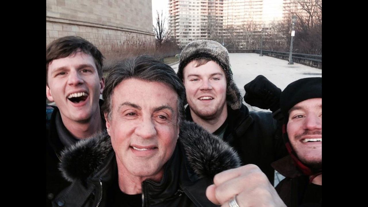 Peter Rowe, right, takes a selfie with friends Jacob Kerstan, left, Andrew Wright, third from left, and actor Sylvester Stallone in Philadelphia on Saturday, January 17. Rowe said the three friends had just finished racing up the steps at the city's Museum of Art, where Stallone filmed the classic training scene in "Rocky," and discovered the actor at the top of the steps.