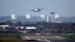 A plane tries to land in cross-winds at Birmingham Airport, UK.