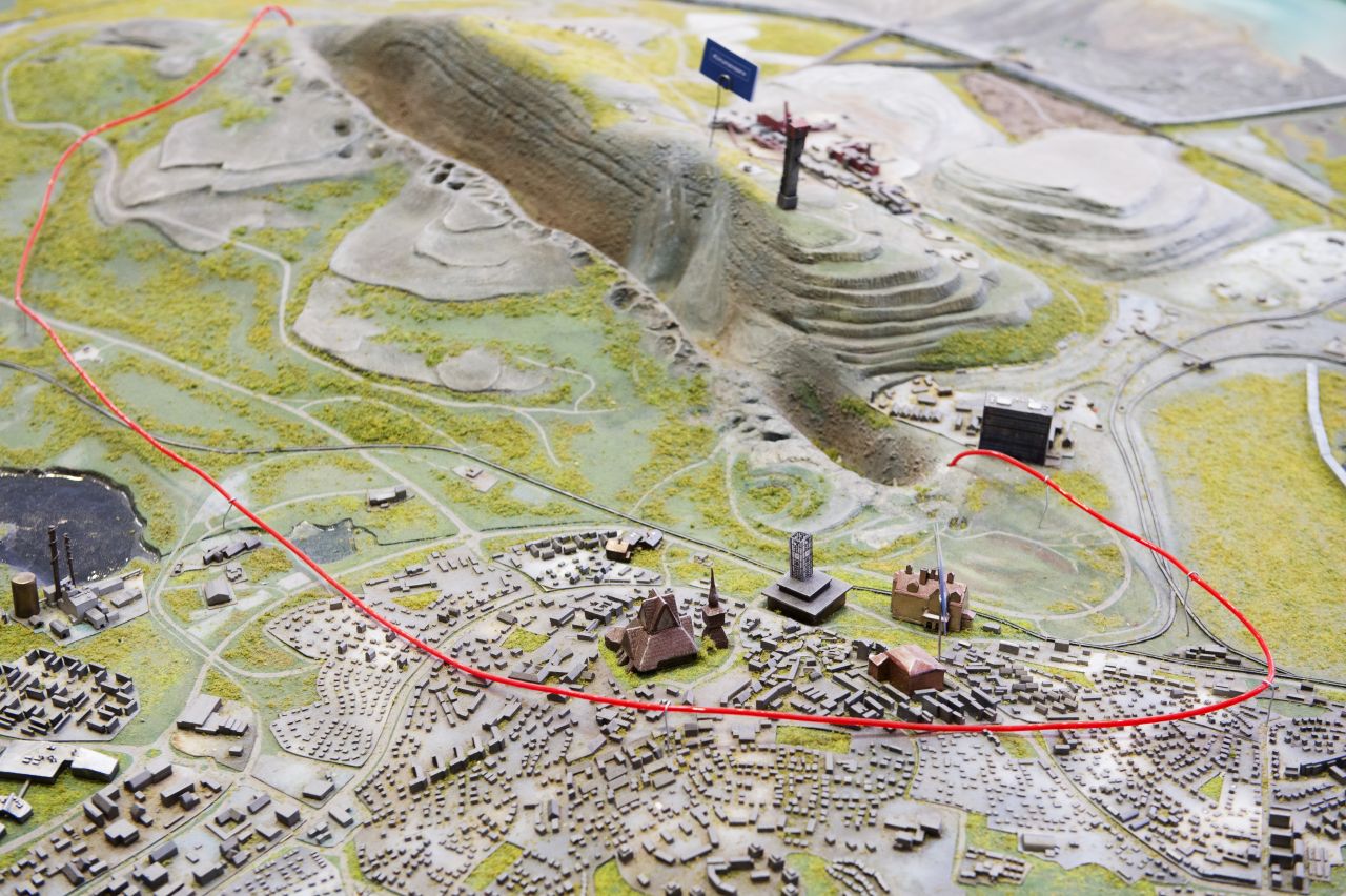 A scale model of Kiruna with the area of the city that will be impacted marked within the red wire.