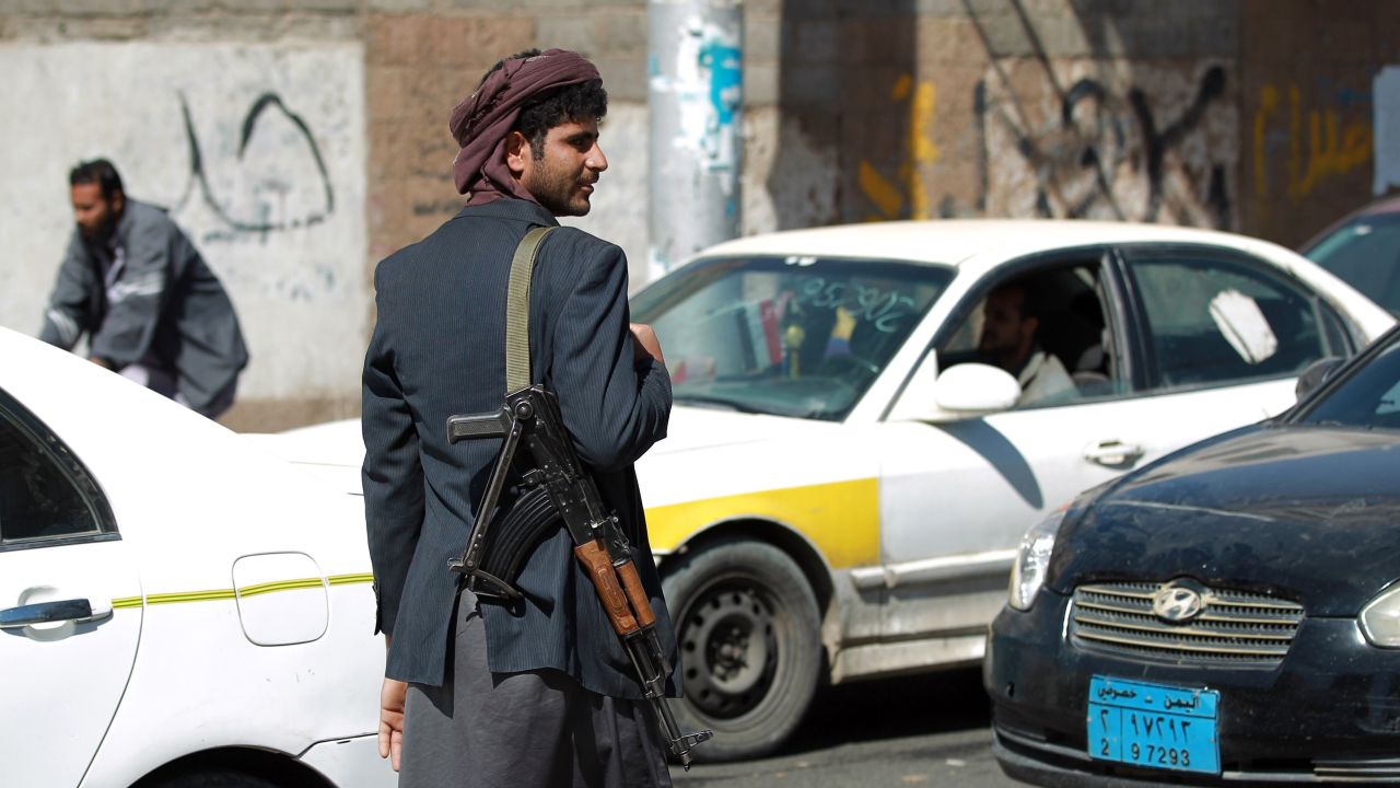 A Houthi rebel mans a checkpoint near the presidential palace on January 21.