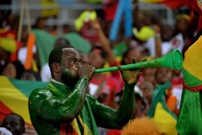 A Congo fan trumpets his support for his team as it beats Gabon 1-0 in a Group A qualifier. 