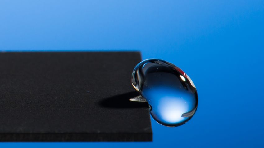 Water bounces off metal treated by a special laser process.